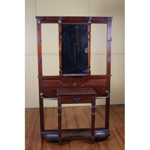 185 - AN EDWARDIAN CARVED MAHOGANY HAT COAT AND STICK STAND the rectangular central mirror above a moulded... 