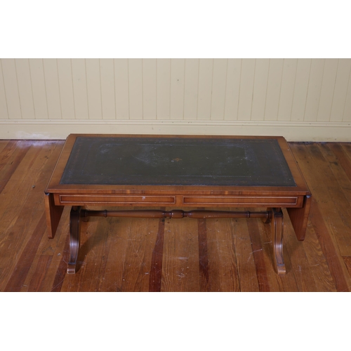 186 - A YEW WOOD DROP LEAF COFFEE TABLE the rectangular hinged top with tooled leather inset on standard e... 