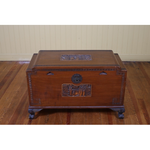 189 - A CAMPHOR WOOD TRUNK the rectangular hinged lid with carved panel containing a slide tray with carve... 