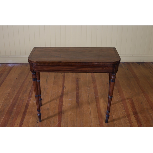 194 - A 19TH CENTURY MAHOGANY FOLDOVER CARD TABLE the rectangular hinged top with moulded apron on ring tu... 