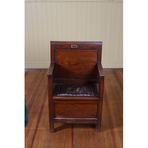 195 - A VINTAGE PITCH PINE SEAT the panelled back with hinged top rail and moulded arms with hinged seat o... 