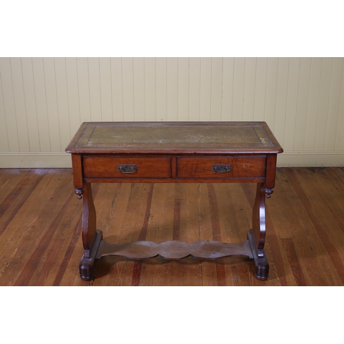 198 - A 19TH CENTURY MAHOGANY WRITING TABLE of rectangular outline with tooled leather inset and two friez... 