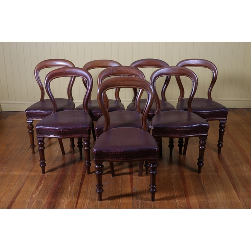 201 - A SET OF EIGHT VICTORIAN MAHOGANY DINING CHAIRS each with a curved top rail with upholstered seats o... 