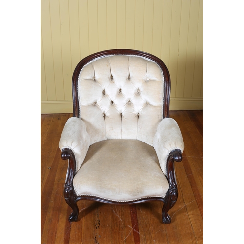 207 - A VICTORIAN CARVED MAHOGANY AND UPHOLSTERED ARMCHAIR with deep buttoned upholstered back and seat wi... 