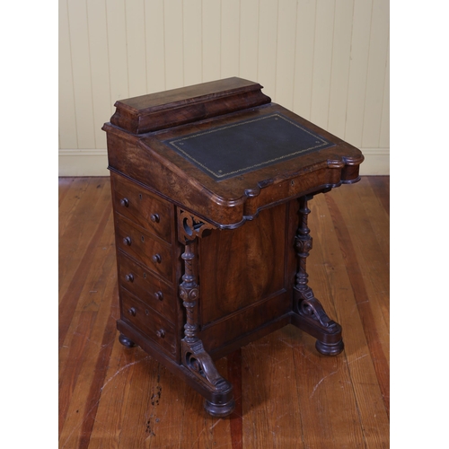 213 - A VICTORIAN BURR WALNUT DAVENPORT the superstructure with hinged compartment with fitted interior ab... 