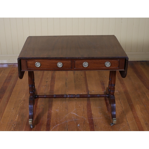 216 - A GEORGIAN STYLE MAHOGANY SOFA TABLE the rectangular hinged top with two frieze drawers and opposing... 