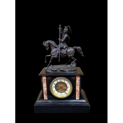 224 - A VINTAGE BLACK SLATE AND SPELTER CLOCK the rectangular case surmounted by a warrior shown seated on... 