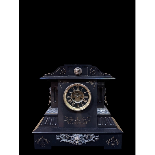 225 - A VINTAGE BLACK MARBLE AND GILT BRASS MANTEL CLOCK of architectural outline the circular dial with R... 