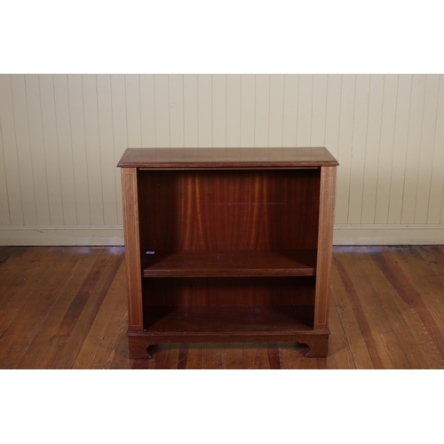 23 - A MAHOGANY AND SATINWOOD INLAID THREE TIER OPEN FRONT BOOKCASE the rectangular top above three open ... 