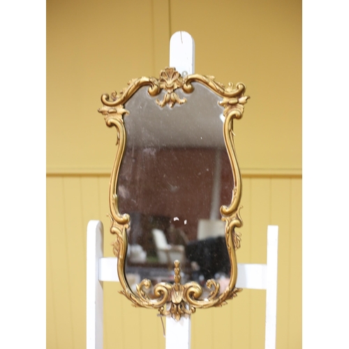 230 - TWO GILT FRAME MIRRORS each with a shaped plate within a foliate and C-scroll frame The larger 82cm ... 