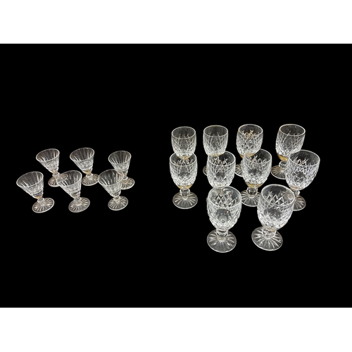 297 - A SET OF SIX WATERFORD CUT GLASS SHERRY GLASSES, a set of six Waterford cut glass port glasses, etc.... 