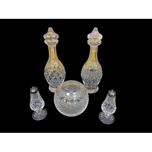 302 - A PAIR OF WATERFORD CUT GLASS DECANTERS with stoppers, a pair of Waterford cut glass salts, etc. (5)