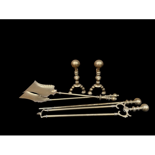 304 - FOUR 19TH CENTURY BRASS FIRE IRONS together with A PAIR OF BRASS FIRE DOGS