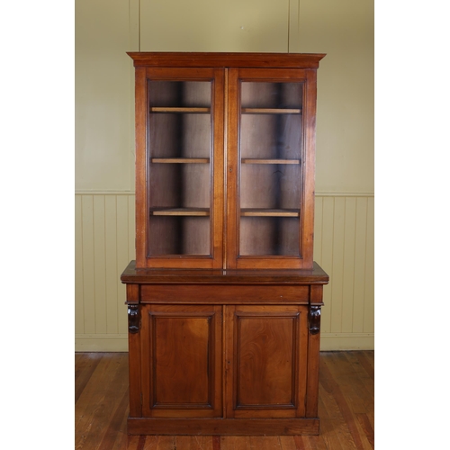 31 - A 19TH CENTURY MAHOGANY TWO DOOR LIBRARY BOOKCASE the moulded cornice above a pair of glazed doors c... 