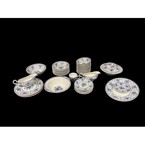 311 - A FORTY SEVEN PIECE BLUE AND WHITE IRONSTONE DINNER SERVICE