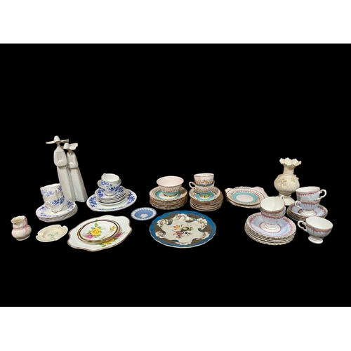 312 - A MISCELLANEOUS COLLECTION to include a Belleek vase, a Lladro group, a Second Period Belleek jug, p... 