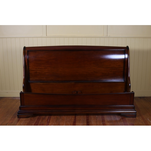 319 - A CHERRYWOOD SLEIGH BED the scroll over headboard with conforming footboard on block feet with side ... 