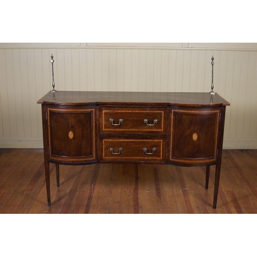 33 - A SHERATON STYLE MAHOGANY AND SATINWOOD INLAID SIDEBOARD of rectangular bowed outline the shaped top... 