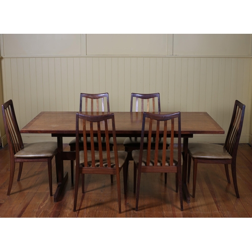 362 - A VINTAGE G-PLAN TEAK EIGHT PIECE DINING ROOM SUITE comprising six rail back chairs with upholstered... 