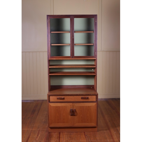 363 - A VINTAGE G-PLAN TEAK WALL CABINET with glazed cupboards above three open shelves the base with one ... 