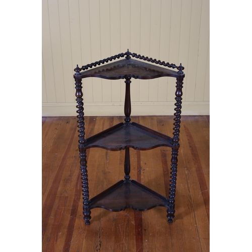 378 - A VICTORIAN ROSEWOOD THREE TIER CORNER WHATNOT with spiral twist gallery above three serpentine shel... 