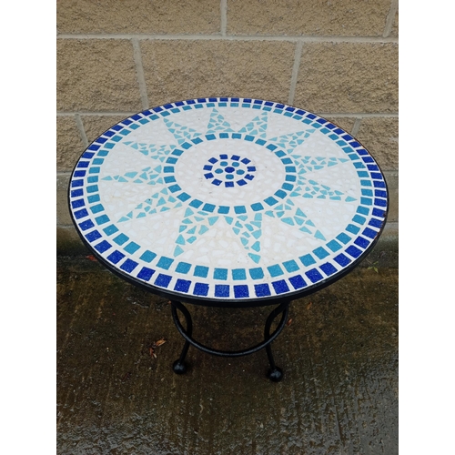 A WROUGHT IRON AND MOSAIC PATIO TABLE of circular outline on splayed
