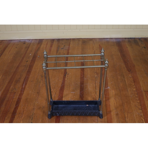 50 - A 19TH CENTURY BRASS AND CAST IRON TWELVE COMPARTMENT STICK STAND with urn finials on pad feet 62cm ... 