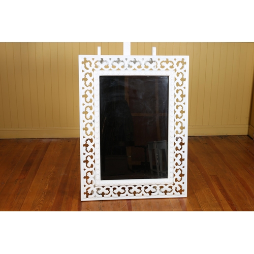 534 - A WHITE FRAME MIRROR the rectangular bevelled glass plate within a pierced C-scroll frame 24cm (h) x... 