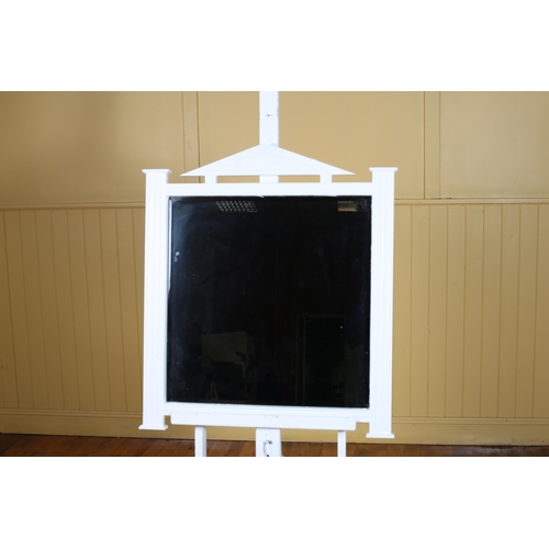 534 - A WHITE FRAME MIRROR the rectangular bevelled glass plate within a pierced C-scroll frame 24cm (h) x... 