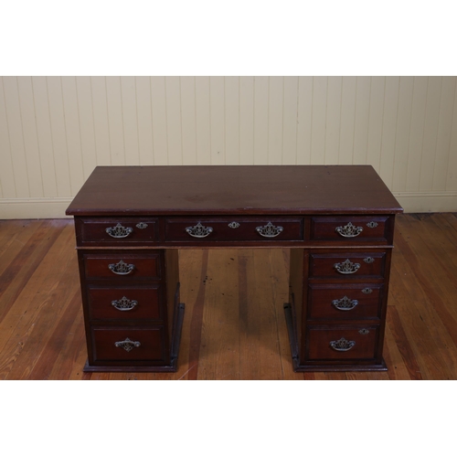 538 - AN EDWARDIAN MAHOGANY PEDESTAL DESK of rectangular outline with three frieze drawers raised on three... 