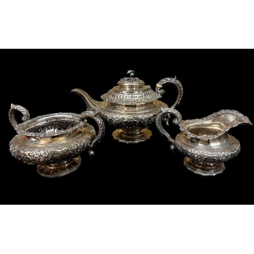 600 - AN IRISH SILVER EMBOSSED THREE PIECE TEA SERVICE Dublin 1835 62 troy oz comprising teapot, sugar bow... 