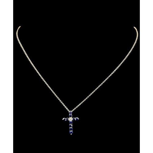 606 - A TIFFANY & CO. PLATINUM SAPPHIRE AND DIAMOND CROSS ON CHAIN Stamped 'Tiffany & Co.'