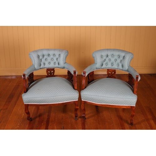 628 - A PAIR OF VINTAGE STAINED BEECHWOOD AND UPHOLSTERED TUB SHAPED CHAIRS each with deep buttoned uphols... 