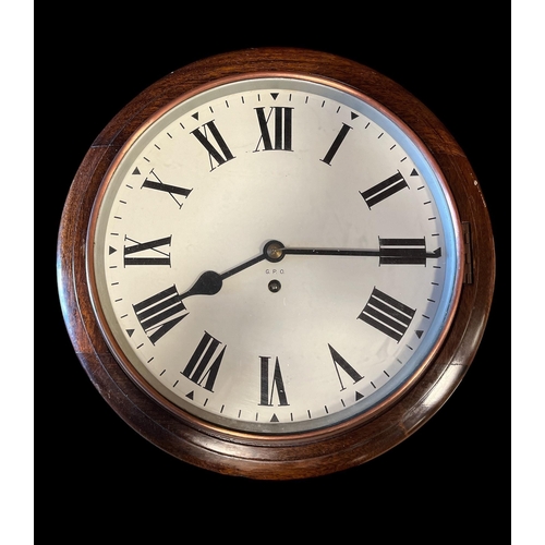 632 - A VINTAGE MAHOGANY CASE WALL CLOCK the circular dial with Roman numerals inscribed 'G.P.O.' 40cm (h)... 