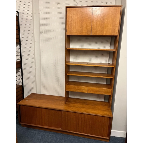 657 - A VINTAGE TEAK WALL UNIT the superstructure with three open shelves, cupboards and two short drawers... 