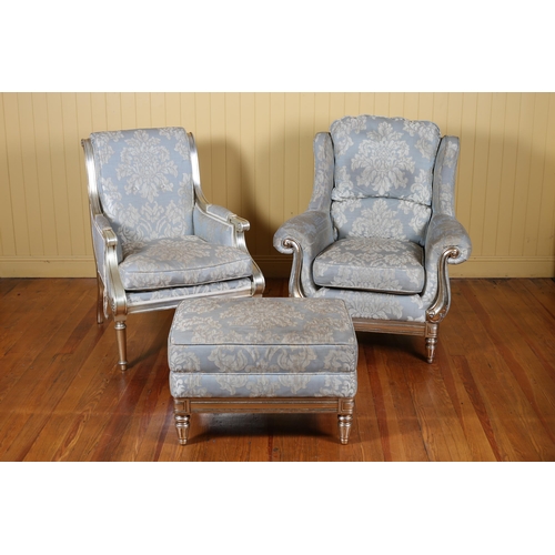 7 - A CONTINENTAL SILVERED AND UPHOLSTERED FOUR PIECE SUITE comprising a two seater settee with scroll o... 