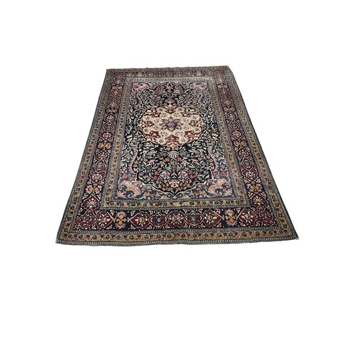 641 - AN ORIENTAL WOOL RUG the multicolour ground with central panel filled with stylised flowerheads and ... 