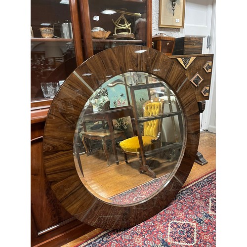 685 - A GIORGIO ROSEWOOD FRAME MIRROR the circular bevelled glass plate within a circular frame with brush... 