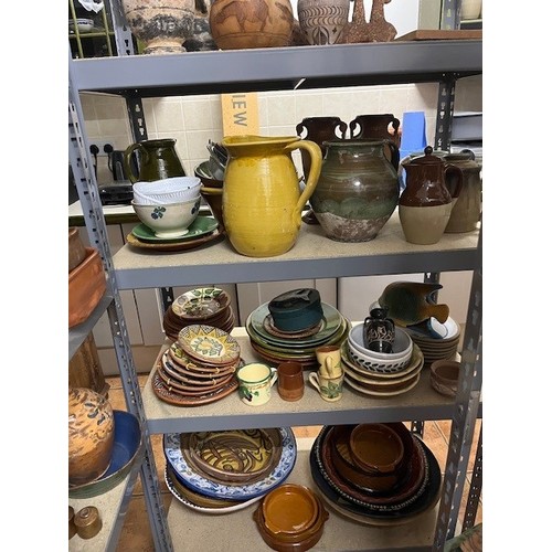 683 - A LARGE COLLECTION OF GLAZED POTTERY to include jugs, bowls etc.