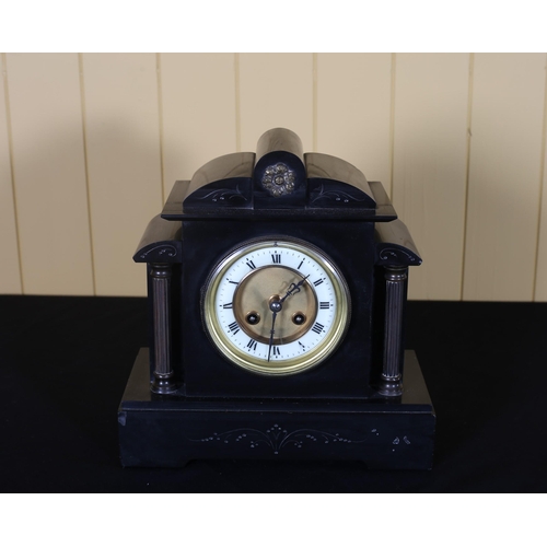 165 - A VINTAGE BLACK AND VEINED MARBLE MANTEL CLOCK of architectural outline the gilt brass dial with Rom... 