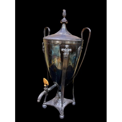 97 - A SILVER PLATED SAMOVAR of urn form with reeded scroll handles on a platform base with bun feet 54cm... 