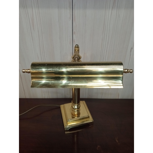 98 - A BRASS DESK LAMP with adjustable shade above a cylindrical column on square stepped base 41cm (h) x... 