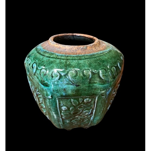 508 - A CHINESE GLAZED POTTERY JAR of octagonal outline the green ground with floral decoration 15cm (h) x... 