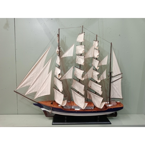 530 - A MODELL OF A TALL SAILING SHIP on ebonised stand 133cm (h) x 154cm (w) x 20cm (d)