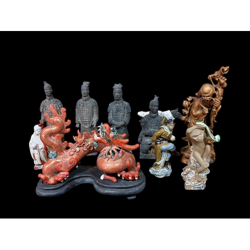 116 - A MISCELLANEOUS COLLECTION to include a Chinese porcelain figure modelled as a dragon on a hardwood ... 