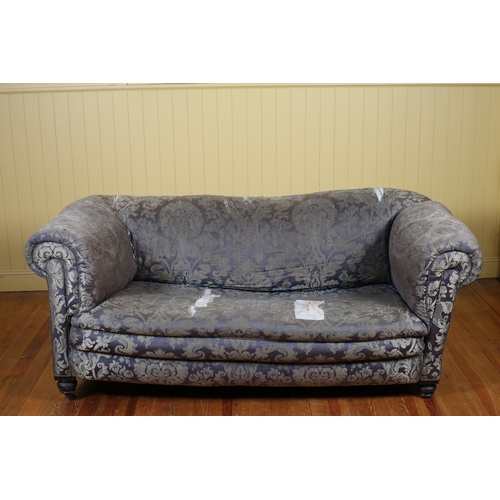 187 - A THREE PIECE VICTORIAN CHESTERFIELD SUITE comprising a settee with scroll over back and arms on mou... 