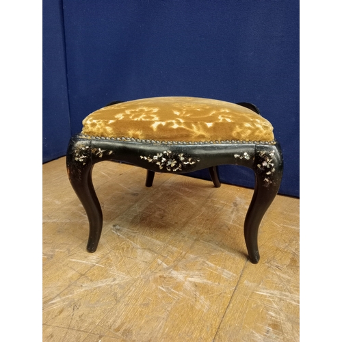 277 - A BLACK LACQUERED MOTHER OF PEARL INLAID AND UPHOLSTERED STOOL the shaped seat above a serpentine fr... 