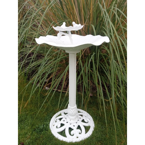 279 - A CAST ALUMINIUM TWO TIER BIRD BATH with lily shaped bowls above a faceted column on a pierced circu... 