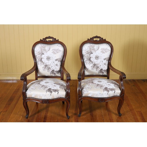 400 - A PAIR OF CONTINENTAL MAHOGANY AND UPHOLSTERED ELBOW CHAIRS each with a pierced C-scroll top rail wi... 