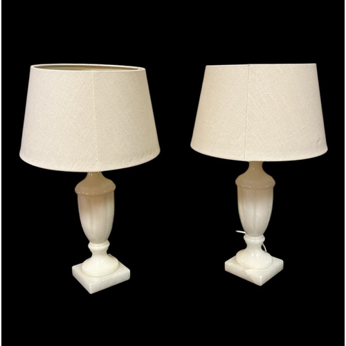 430 - A PAIR OF WHITE ALABASTER URN SHAPED TABLE LAMPS with shades 57cm (h)